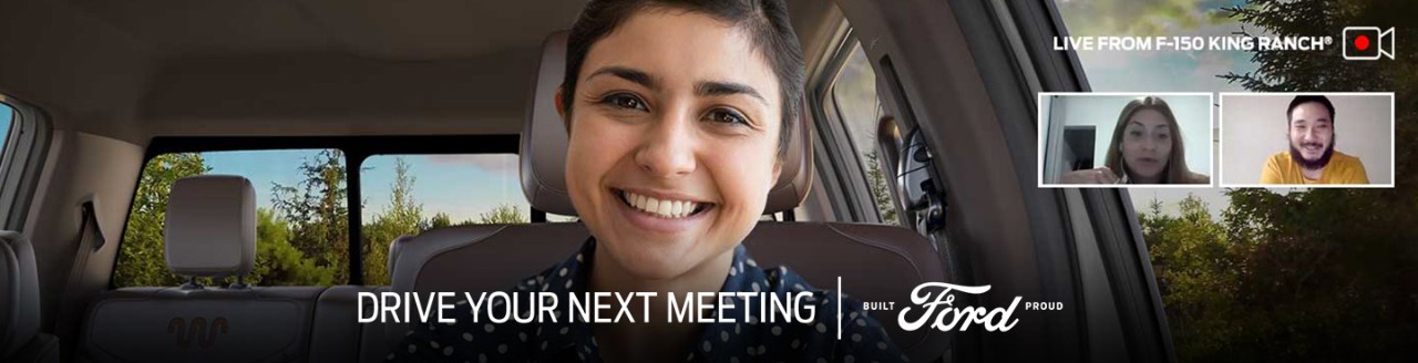 Woman with Ford F 1 50 virtually in background of a video chat Live from F 1 50 King Ranch Drive Your Next Meeting Built Ford Proud