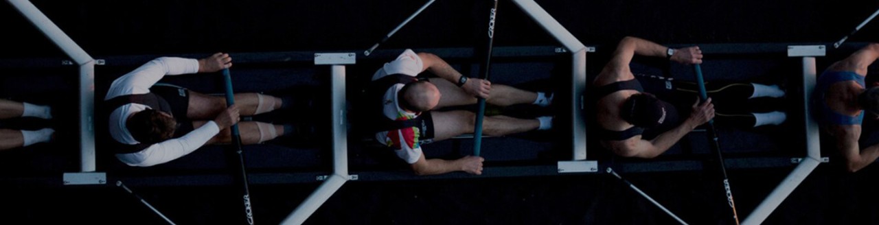 Picture of men on a rowing team from overhead
