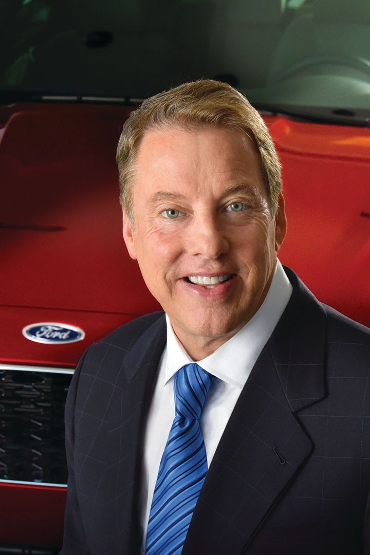 William Clay Ford Jr., at an auto event, smiles to camera