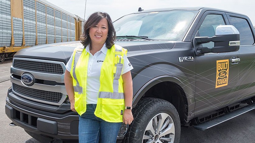 Linda Zhang, chief engineer of the Ford F-150, with the F-150 all-electric prototype.