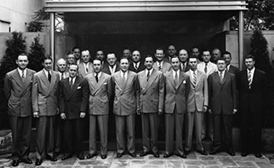 Black and white photo of a group of men