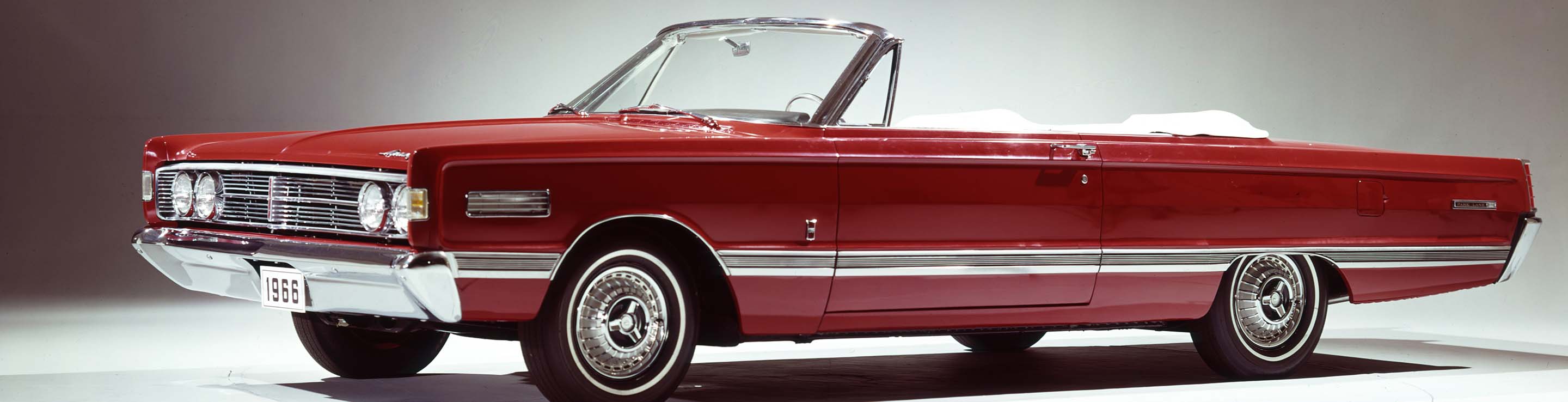 A red 1966 Mercury Park Lane convertible