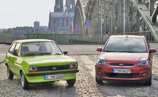 Color photo of a 1976 and a 2006 Ford Fiesta