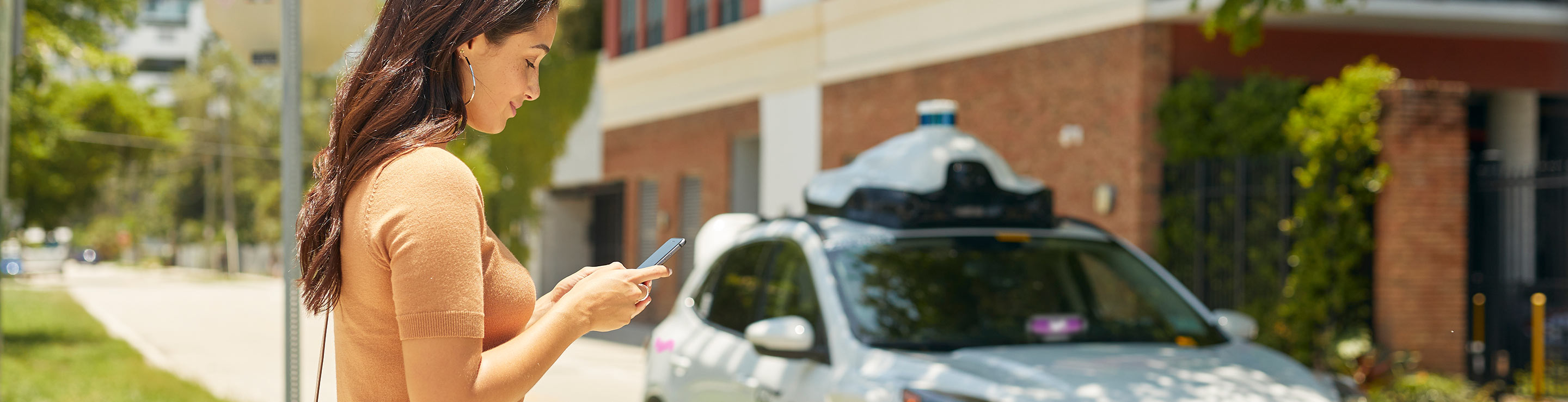 Woman in front of house callung lyft argo ford
