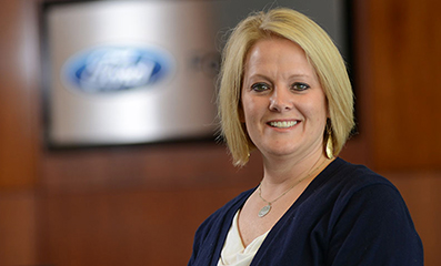 Female employee smiling for the camera