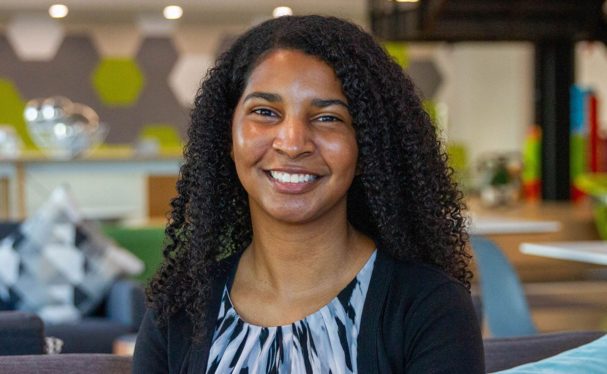 Female employee smiling for camera