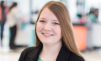 Female employee smiling for camera