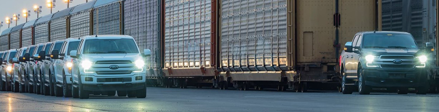 f150s in front of train