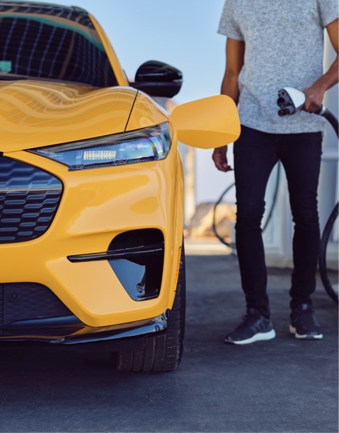 Man using an electric charger on a Mustang Mach-E GT Performance Edition