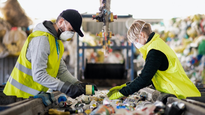People sorting waste for recycling