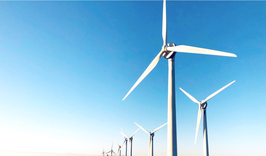 Wind turbines against a blue sky