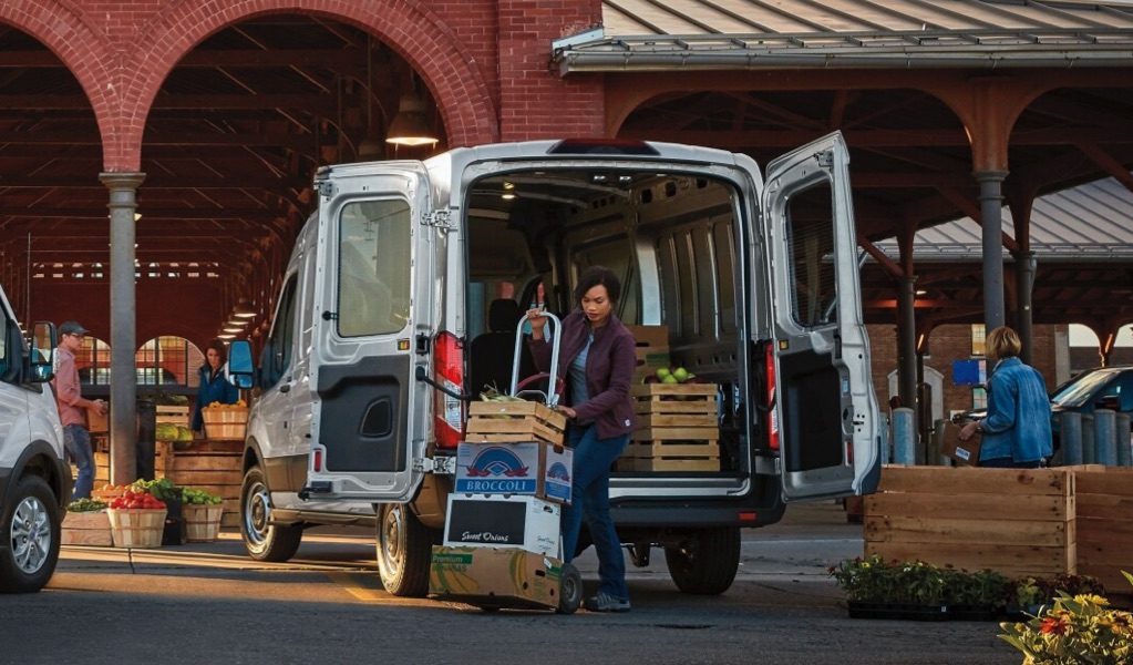 Workers unloading 2021 Ford Transits