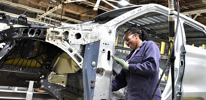 Image of woman working on assembly line