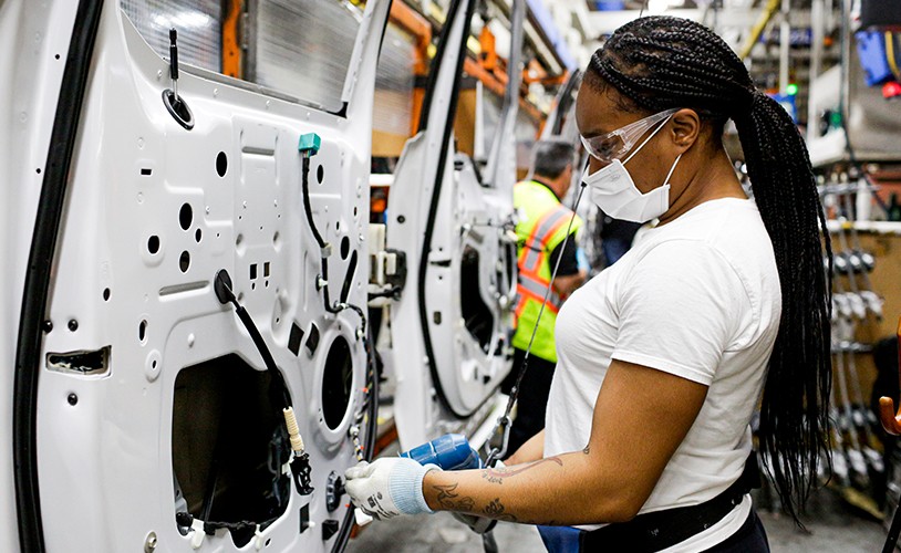 A woman on an assembly line