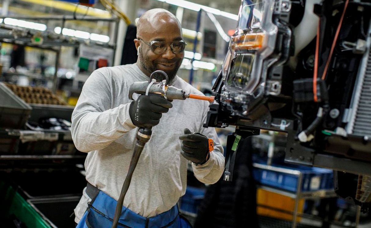 A woman on an assembly line